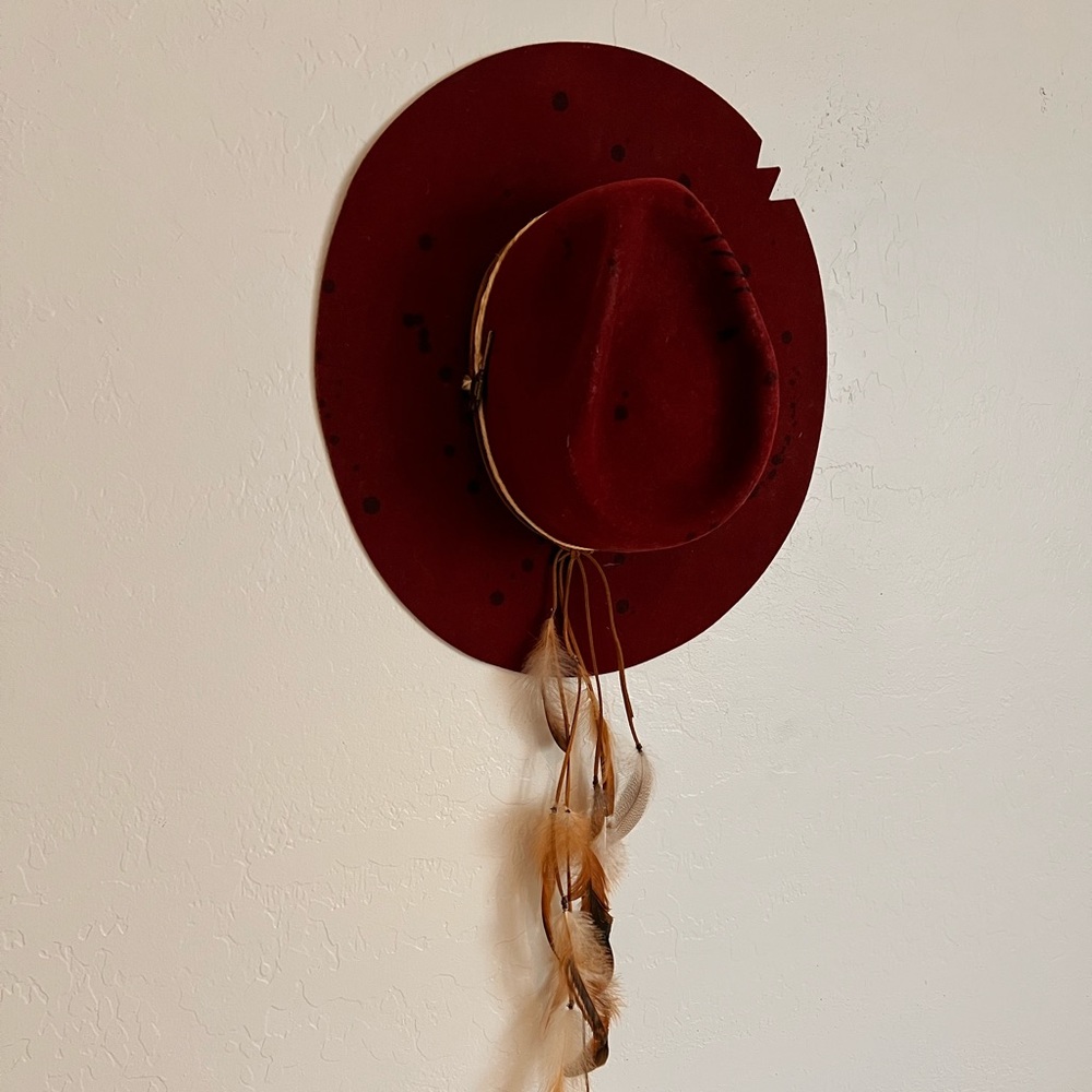 Maroon Cowboy hat.